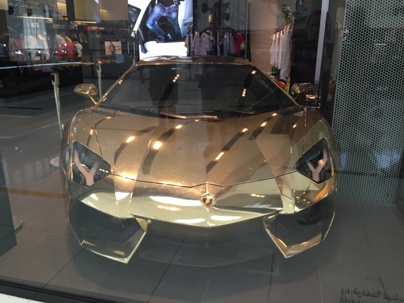 A gold Lamborghini at the shop in Dubai Mall
