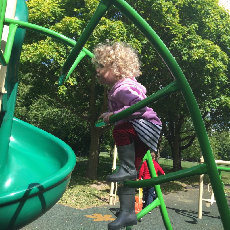 Mrs T on the climbing frame at the playground