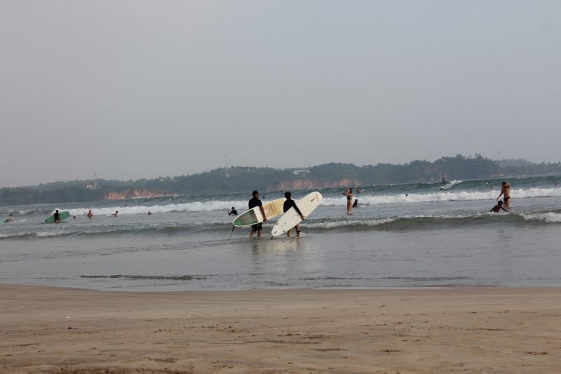Surfers in Matara, Sri Lanka