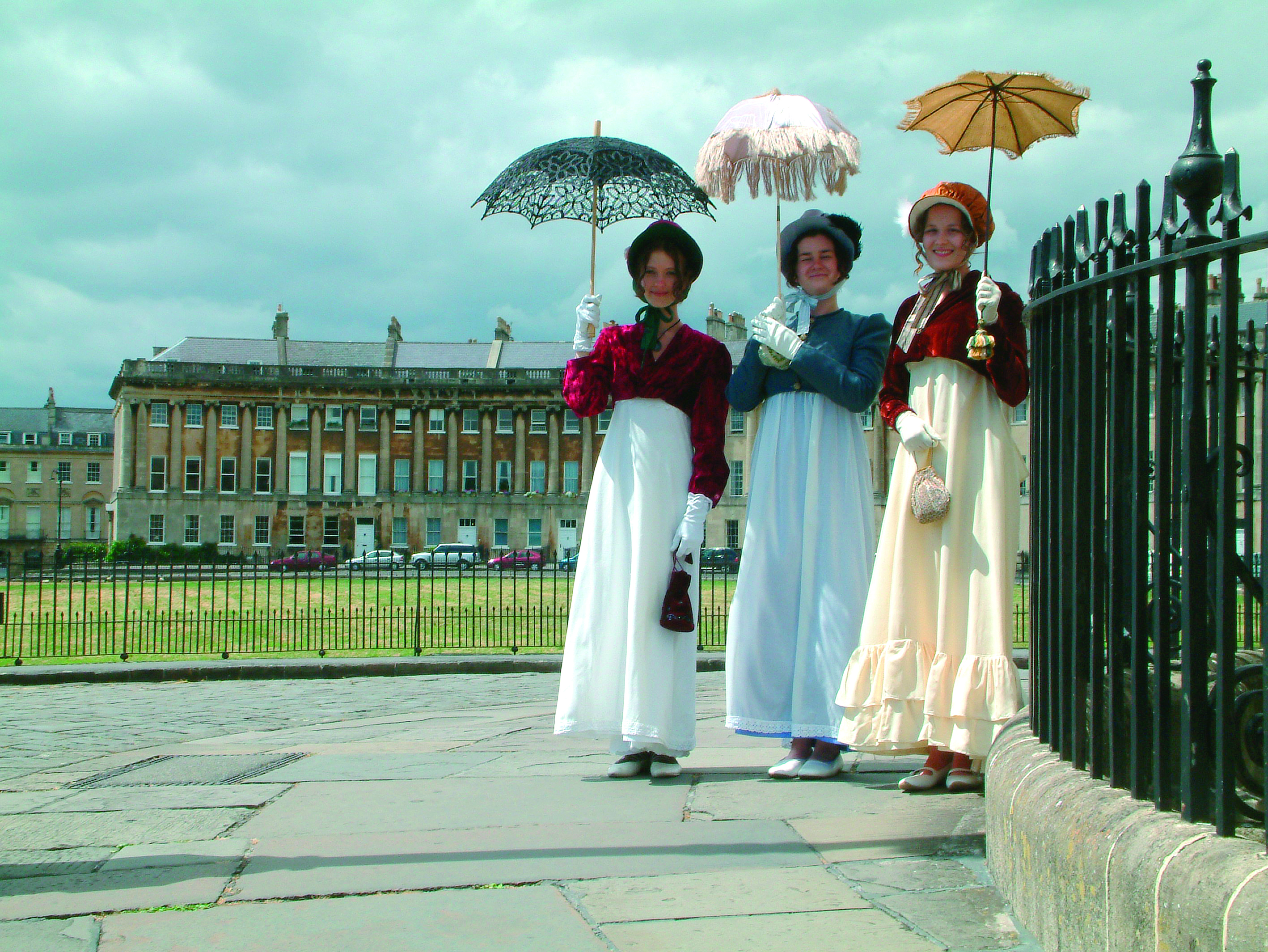 Three women in period costume at the Jane Austen Festival