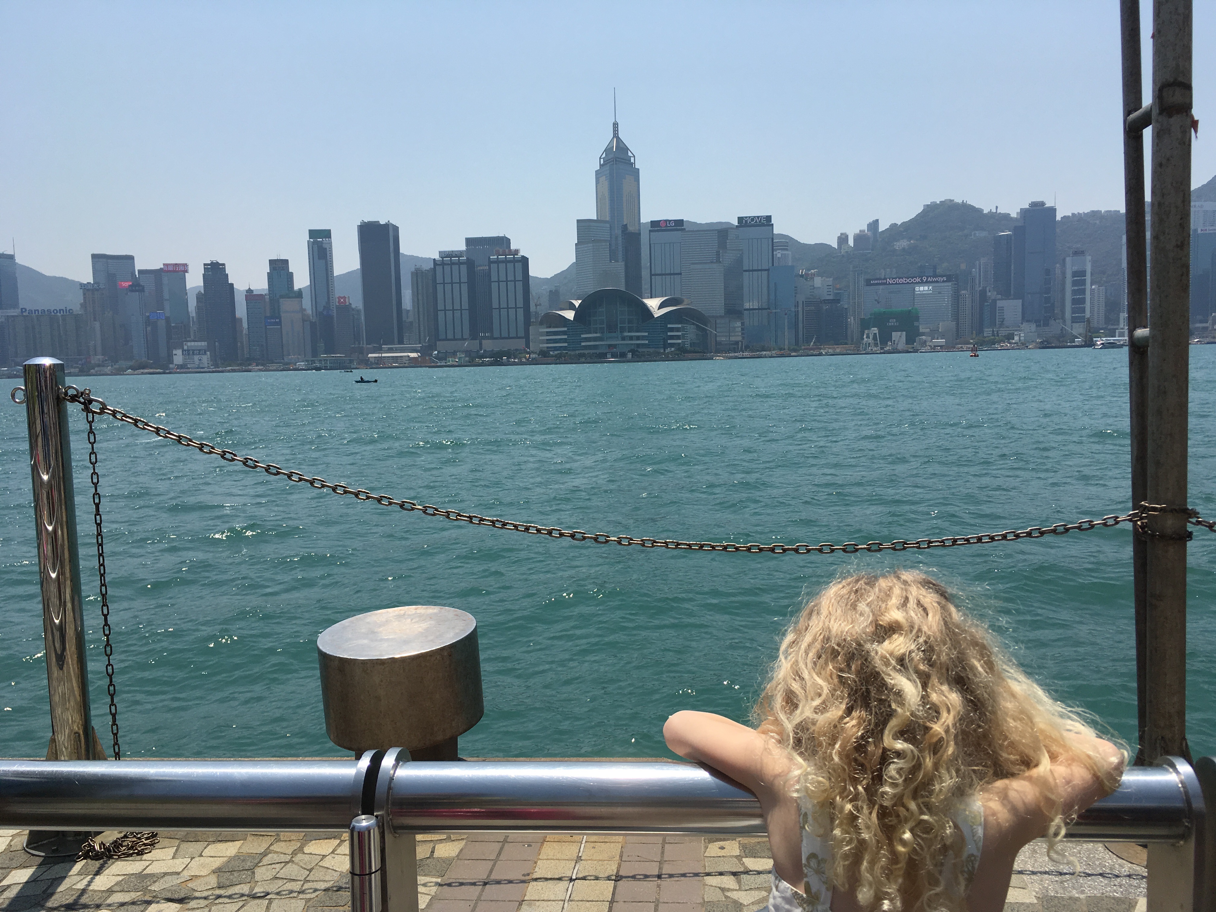 Mrs T on the Tsim Sha Tsui Promenade, Hong Kong with kids