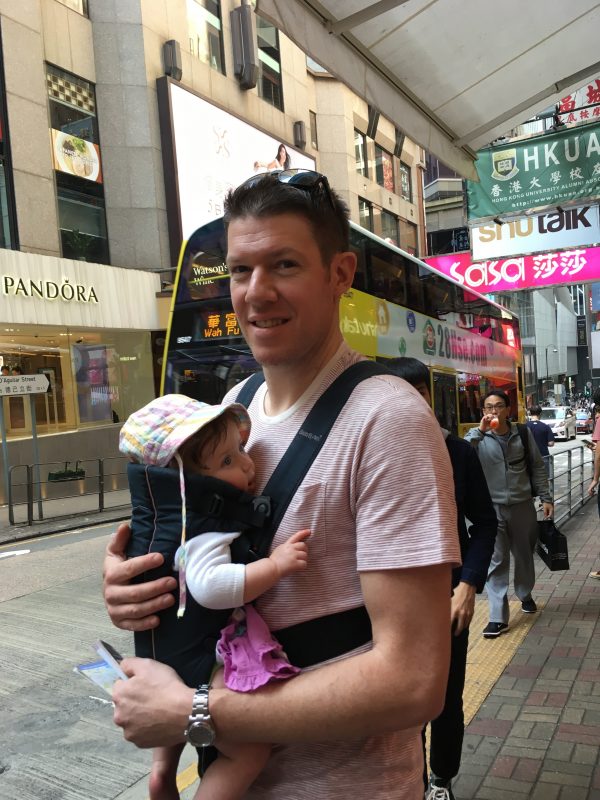Cheeky in the baby carrier, Hong Kong