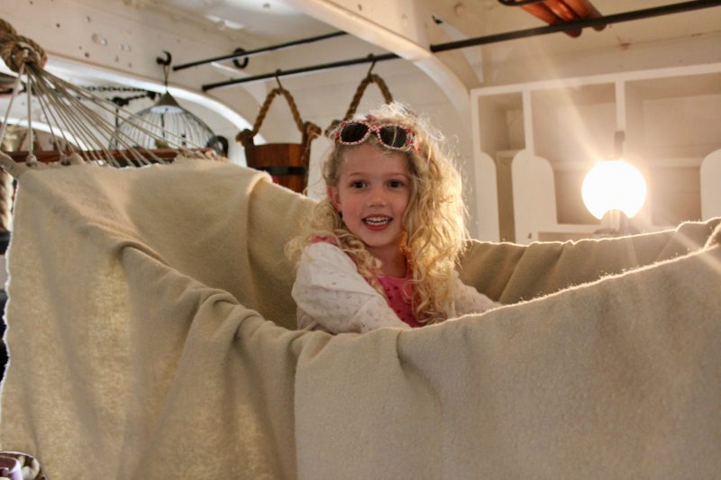 Mrs T in a hammock in HMS Warrior